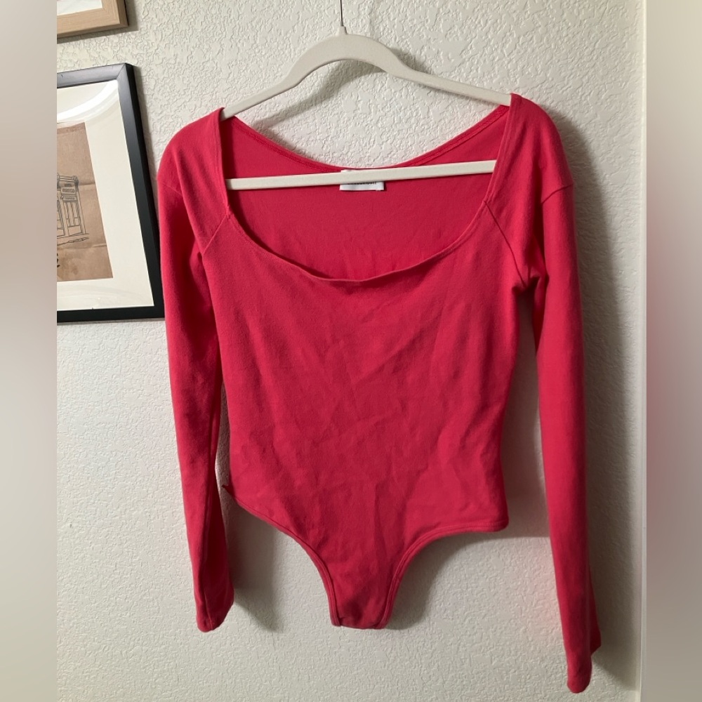 Gil Rodriguez El Tigre Long Sleeve Bodysuit in color Hibiscus